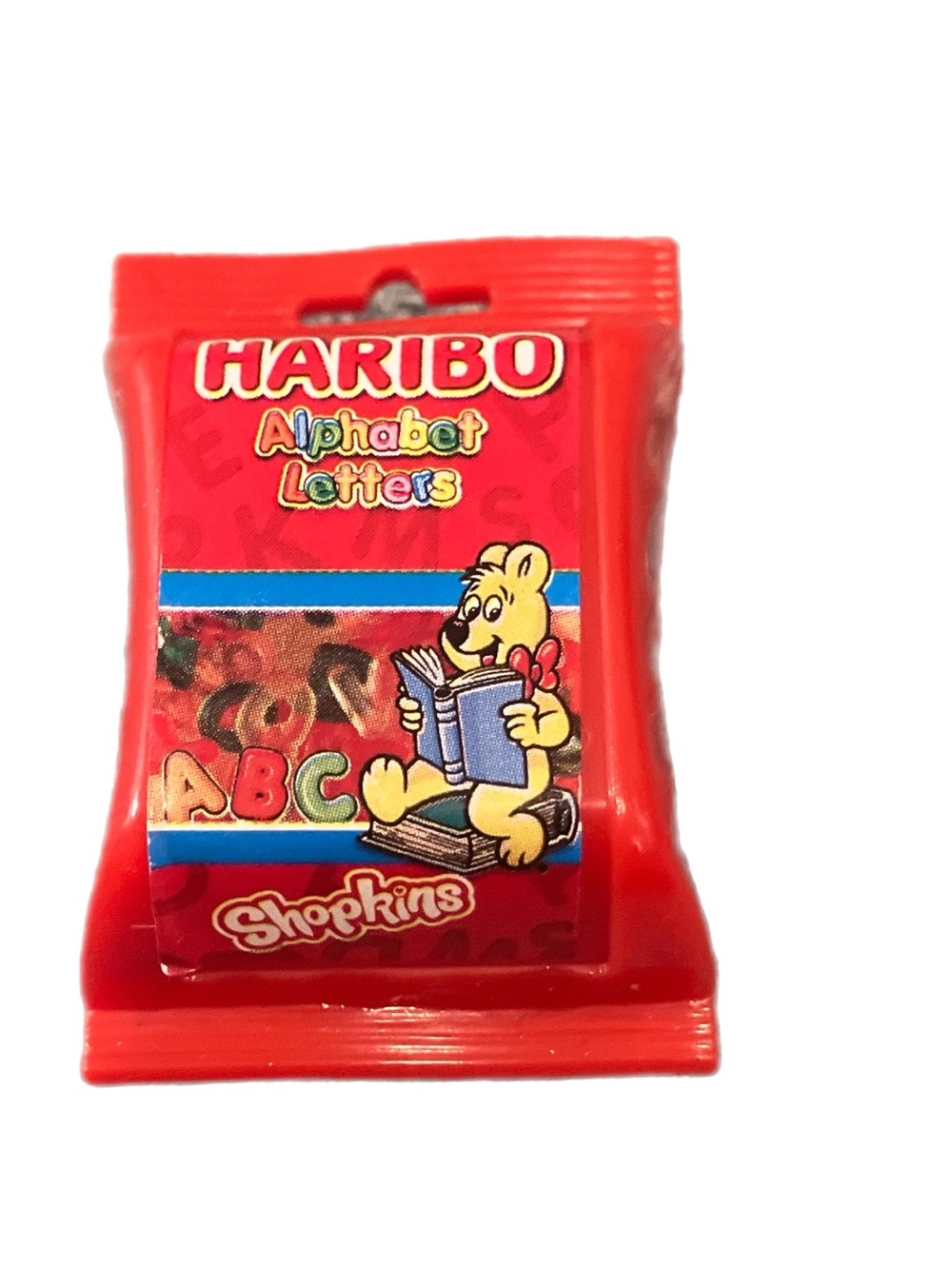 HARIBO Red Alphabet Letters Toy Gummies Pack with Yellow Bear Illustration